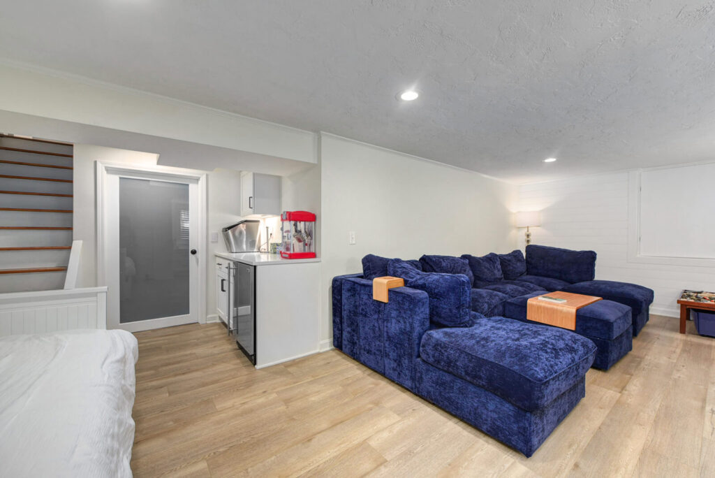 Blue Couch in Room Featuring Elegant Hardwood Floors