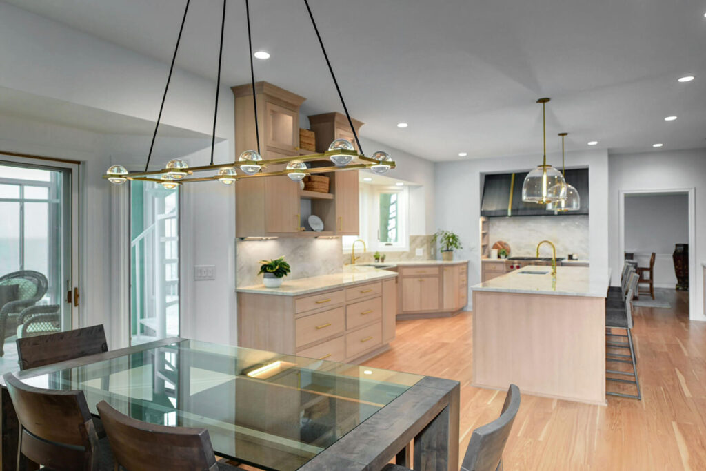 A cozy kitchen featuring a dining table surrounded by chairs, creating an inviting space for meals and gatherings.