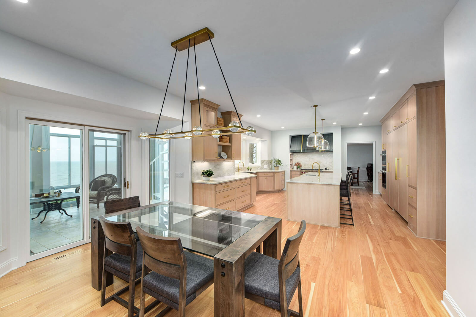 A spacious kitchen and dining area featuring elegant hardwood floors, creating a warm and inviting atmosphere.